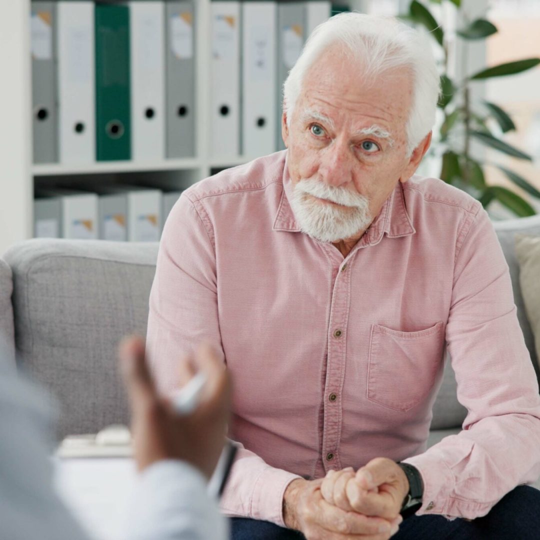 psychologist-therapy-or-old-man-consulting-in-coun-QZLU94X-scaled.jpg